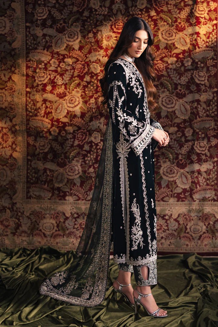 Model wearing Qalamkar Velvet Edit '24 BK - 03 SAMIRA, an elegant black velvet dress with intricate silver embroidery, ideal for weddings. Available as Pakistani clothes online in the UK.