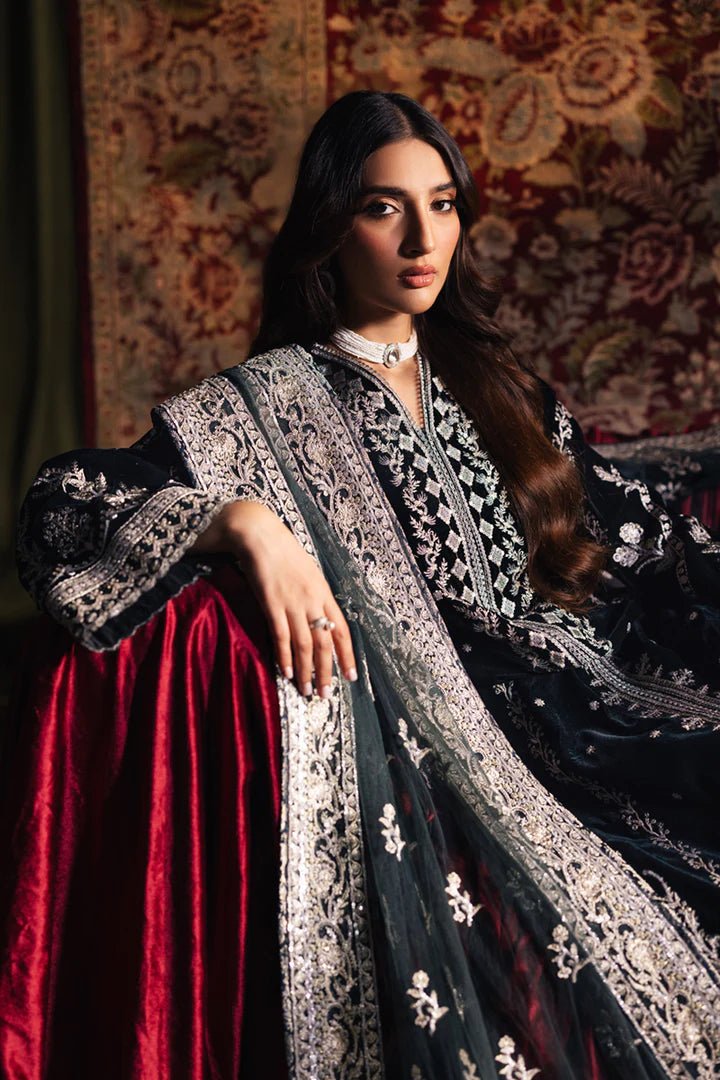 Model wearing Qalamkar Velvet Edit '24 BK - 03 SAMIRA, an elegant black velvet dress with intricate silver embroidery, ideal for weddings. Available as Pakistani clothes online in the UK.