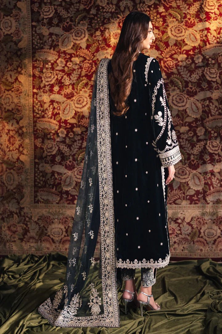 Model wearing Qalamkar Velvet Edit '24 BK - 03 SAMIRA, an elegant black velvet dress with intricate silver embroidery, ideal for weddings. Available as Pakistani clothes online in the UK.