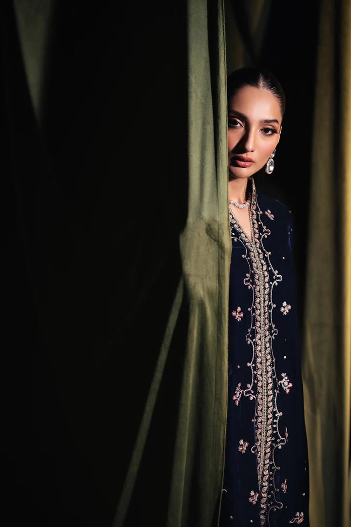 Model wearing Qalamkar Velvet Edit '24 BK - 05 DALIA, an elegant navy velvet dress with intricate embroidery, ideal for weddings. Available as Pakistani clothes online in the UK.