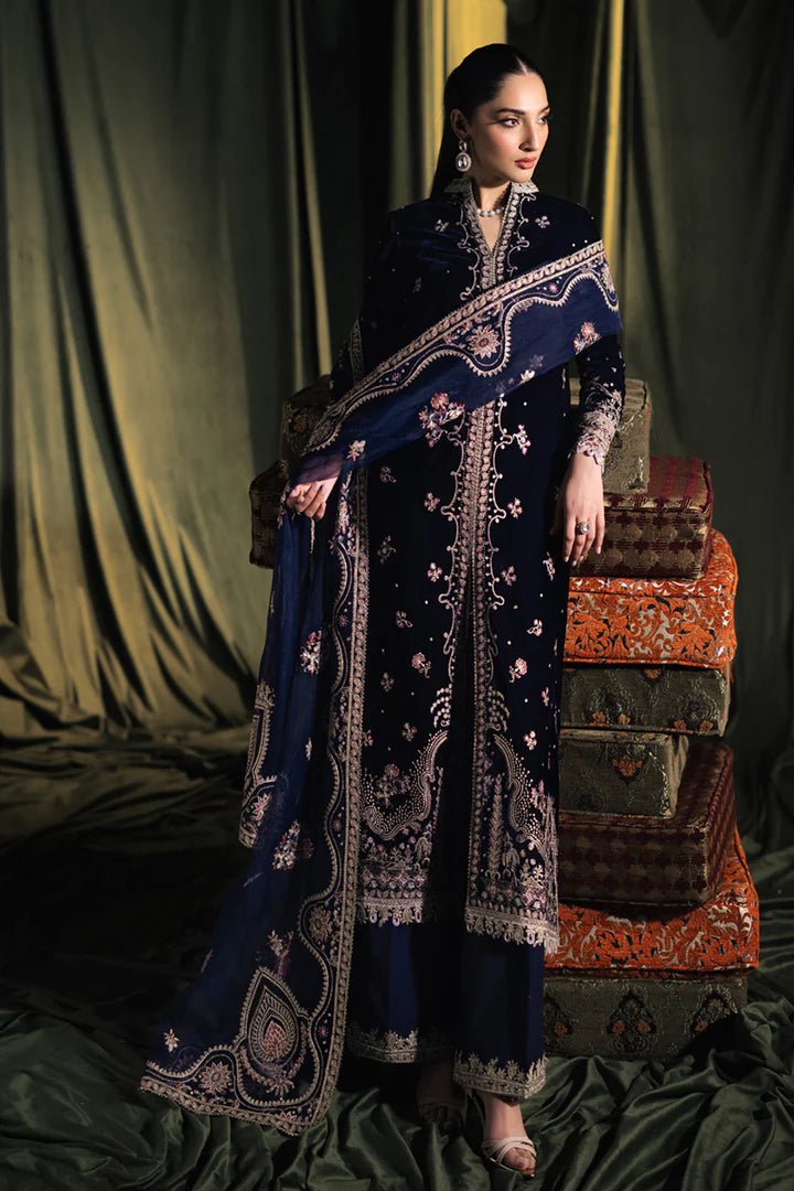 Model wearing Qalamkar Velvet Edit '24 BK - 05 DALIA, an elegant navy velvet dress with intricate embroidery, ideal for weddings. Available as Pakistani clothes online in the UK.