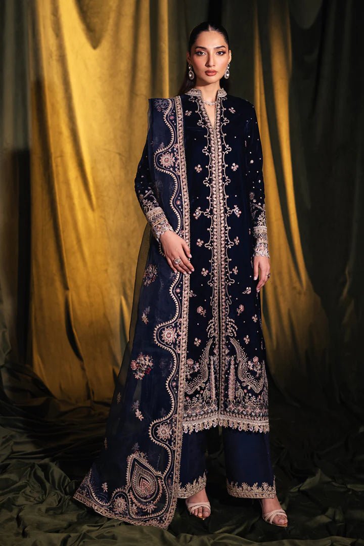 Model wearing Qalamkar Velvet Edit '24 BK - 05 DALIA, an elegant navy velvet dress with intricate embroidery, ideal for weddings. Available as Pakistani clothes online in the UK.