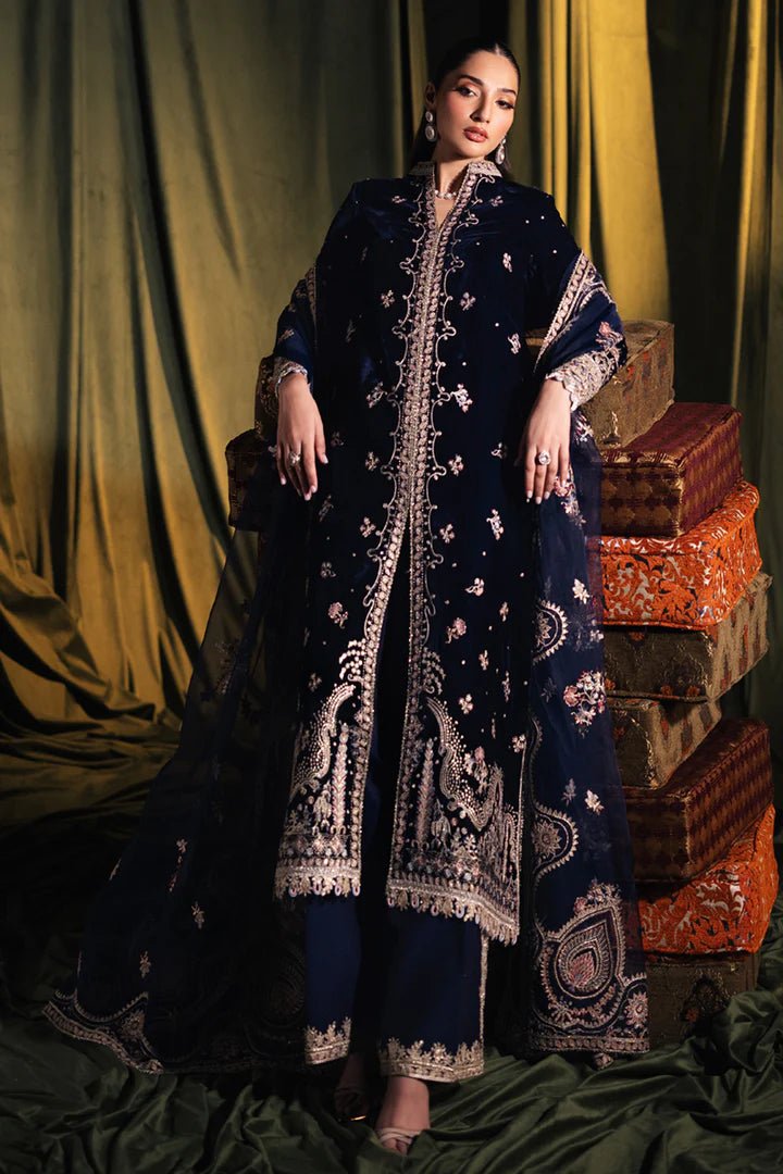 Model wearing Qalamkar Velvet Edit '24 BK - 05 DALIA, an elegant navy velvet dress with intricate embroidery, ideal for weddings. Available as Pakistani clothes online in the UK.