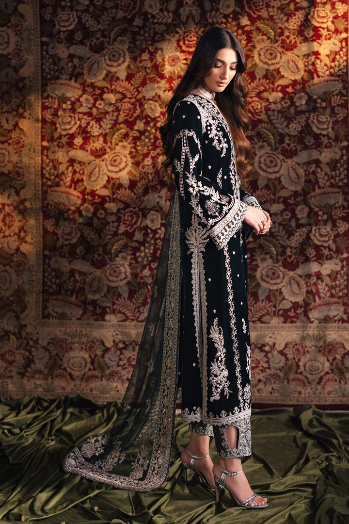 Model wearing Qalamkar Velvet Edit '24 BK-03 SAMIRA, an elegant black velvet dress with intricate silver embroidery, ideal for weddings. Available as Pakistani clothes online in the UK.