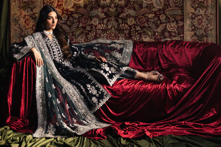 Model wearing Qalamkar Velvet Edit '24 BK-03 SAMIRA, an elegant black velvet dress with intricate silver embroidery, ideal for weddings. Available as Pakistani clothes online in the UK.