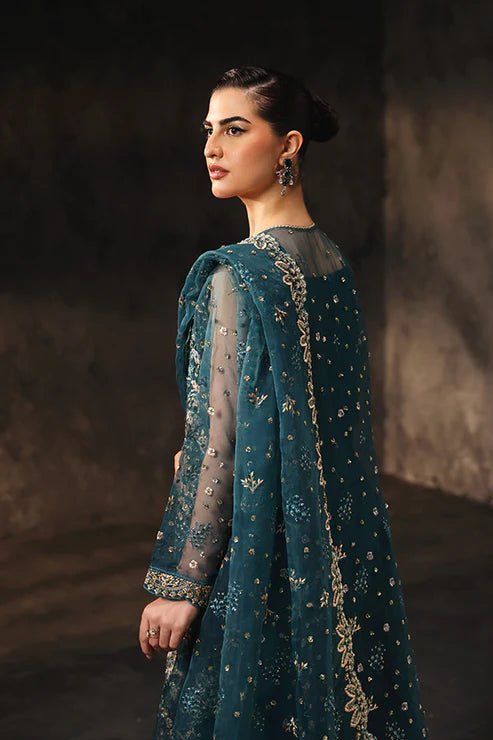 Model wearing Saffron Gulzar - e - Afreen dress in deep teal from the Aatish Formals collection, showcasing intricate embroidery. Perfect for Pakistani wedding clothes online in the UK.