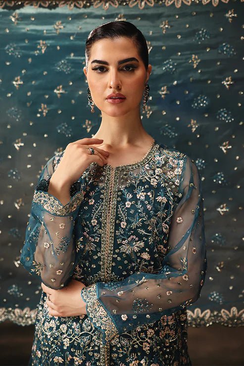 Model wearing Saffron Gulzar - e - Afreen dress in deep teal from the Aatish Formals collection, showcasing intricate embroidery. Perfect for Pakistani wedding clothes online in the UK.