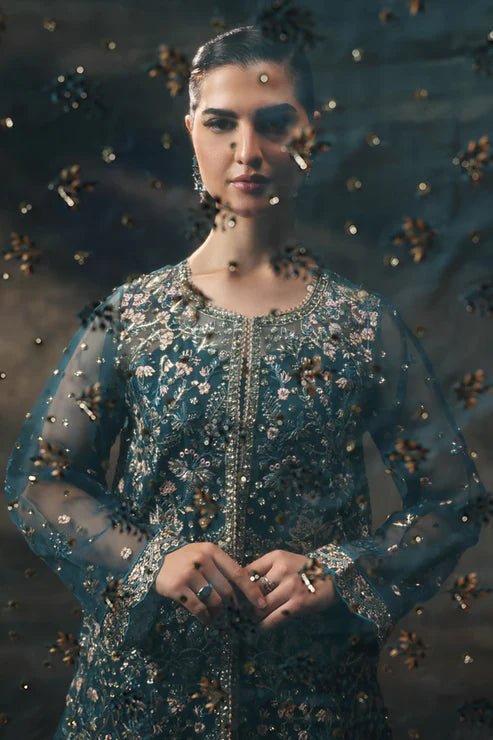 Model wearing Saffron Gulzar - e - Afreen dress in deep teal from the Aatish Formals collection, showcasing intricate embroidery. Perfect for Pakistani wedding clothes online in the UK.