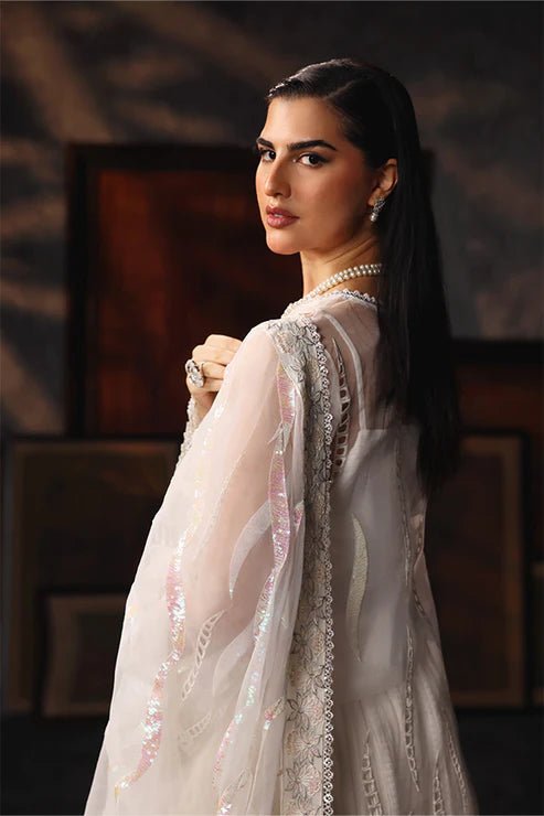 Model wearing Saffron Mah - e - Khusnuma dress in elegant white from the Aatish Formals collection, perfect for Pakistani wedding clothes online in the UK.