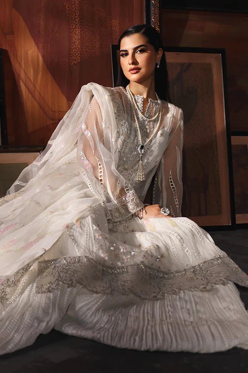 Model wearing Saffron Mah - e - Khusnuma dress in elegant white from the Aatish Formals collection, perfect for Pakistani wedding clothes online in the UK.