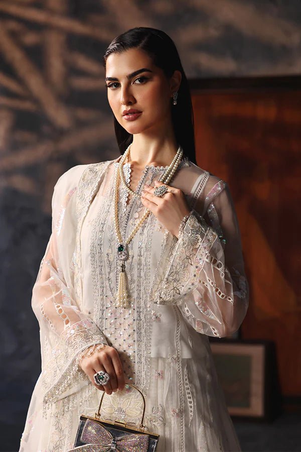 Model wearing Saffron Mah - e - Khusnuma dress in elegant white from the Aatish Formals collection, perfect for Pakistani wedding clothes online in the UK.