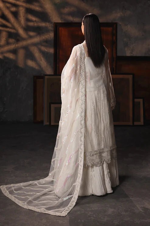 Model wearing Saffron Mah - e - Khusnuma dress in elegant white from the Aatish Formals collection, perfect for Pakistani wedding clothes online in the UK.