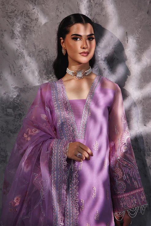 Model wearing Saffron Noor - e - Hunar dress in elegant lavender from the Aatish Formals collection, perfect for Pakistani wedding clothes online in the UK.