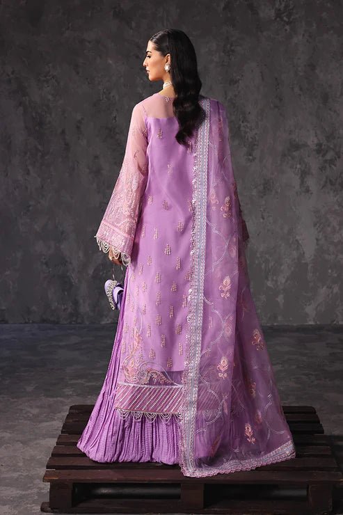 Model wearing Saffron Noor - e - Hunar dress in elegant lavender from the Aatish Formals collection, perfect for Pakistani wedding clothes online in the UK.