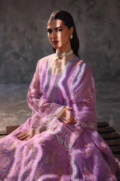 Model wearing Saffron Noor - e - Hunar dress in elegant lavender from the Aatish Formals collection, perfect for Pakistani wedding clothes online in the UK.