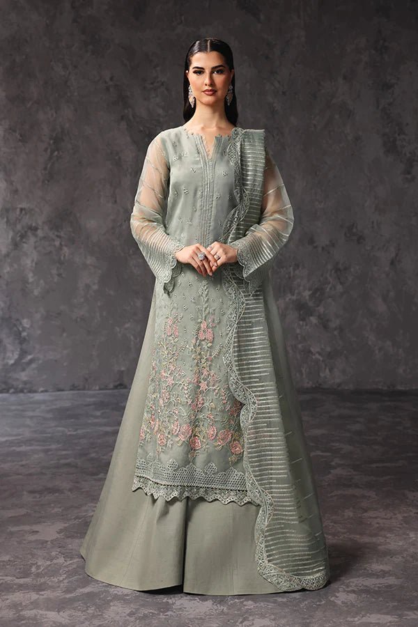 Model wearing Saffron Sehar - e - Shama dress in soft green from the Aatish Formals collection, available for Pakistani wedding clothes online in the UK.