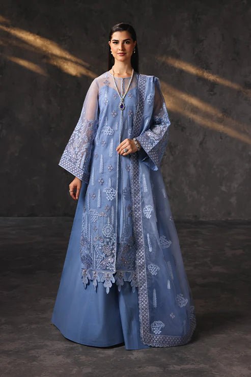 Model wearing Saffron Shama - e - Feroz dress in blue from the Aatish Formals collection, available for Pakistani wedding clothes online in the UK.