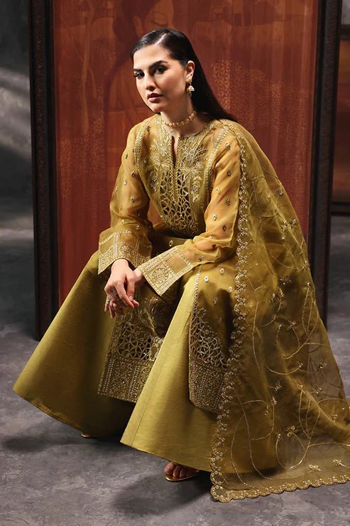 Model wearing Saffron Shola - e - Noor dress in mustard from the Aatish Formals collection, perfect for weddings, available for Pakistani clothes online in the UK.