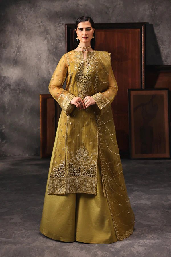 Model wearing Saffron Shola - e - Noor dress in mustard from the Aatish Formals collection, perfect for weddings, available for Pakistani clothes online in the UK.