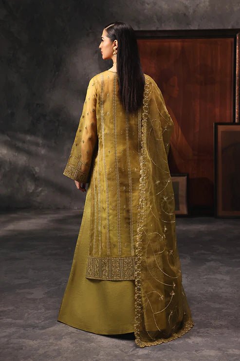 Model wearing Saffron Shola - e - Noor dress in mustard from the Aatish Formals collection, perfect for weddings, available for Pakistani clothes online in the UK.