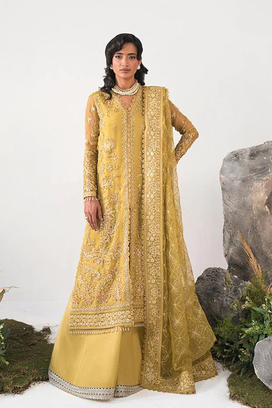 Model in Saffron Elmira, Pakistani festive dress, UK exclusive.