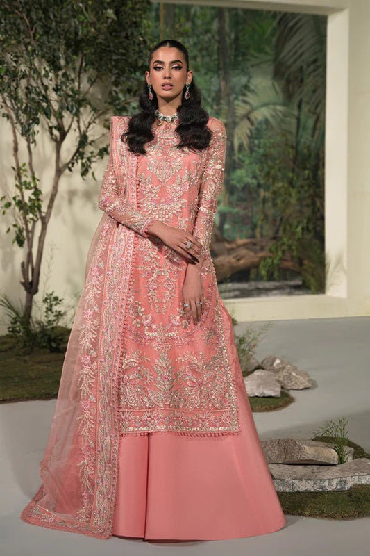 Model in Saffron Nousha Dress, pink Pakistani elegance, UK festive wear.