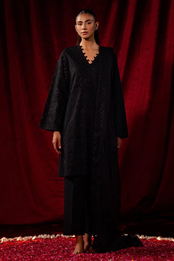 Elevate your winter wardrobe with Black Dahlia from Saffron's Celestial Fall '24 for £90. A stunning black khaddar set with a textured net dupatta. Shop Pakistani winter clothes online in UK at Signature Labels.