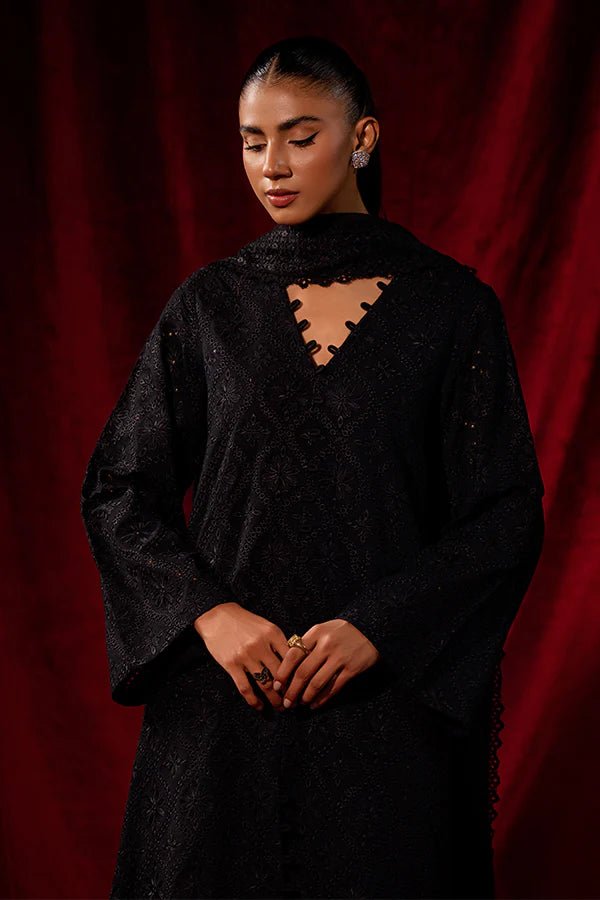 Elevate your winter wardrobe with Black Dahlia from Saffron's Celestial Fall '24 for £90. A stunning black khaddar set with a textured net dupatta. Shop Pakistani winter clothes online in UK at Signature Labels.