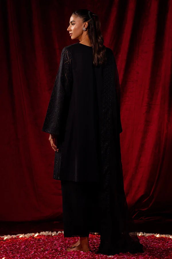 Elevate your winter wardrobe with Black Dahlia from Saffron's Celestial Fall '24 for £90. A stunning black khaddar set with a textured net dupatta. Shop Pakistani winter clothes online in UK at Signature Labels.