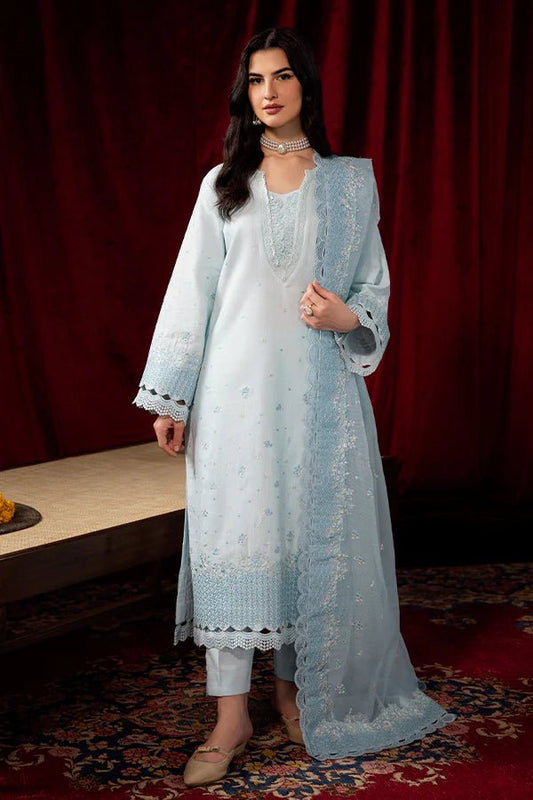 Model wearing Saffron Celestial Fall '24 BLUE MIRAGE, a serene light blue outfit with intricate embroidery, perfect for winter fashion, showcasing Saffron’s Pakistani designer clothes online in the UK.