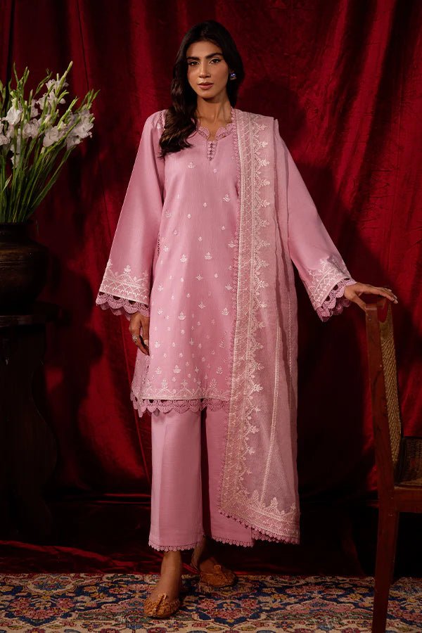 Model wearing a pink Blush Breeze dress from Saffron, featuring delicate embroidery, perfect for winter, showcasing Pakistani designer clothes online in the UK.