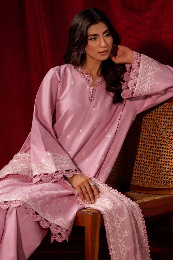 Model wearing a pink Blush Breeze dress from Saffron, featuring delicate embroidery, perfect for winter, showcasing Pakistani designer clothes online in the UK.