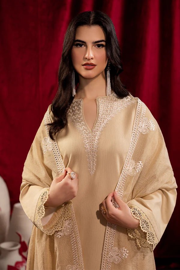 Model wearing Saffron Celestial Fall '24 FROSTED BEIGE, a graceful beige outfit with delicate embroidery, ideal for winter. Available as Pakistani designer clothes online in the UK.