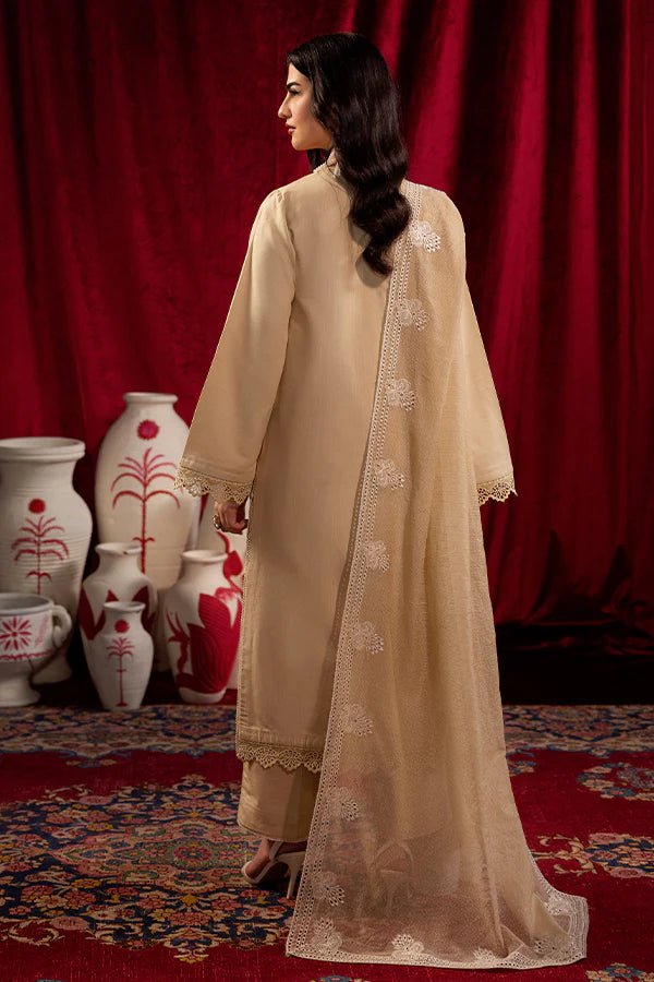 Model wearing Saffron Celestial Fall '24 FROSTED BEIGE, a graceful beige outfit with delicate embroidery, ideal for winter. Available as Pakistani designer clothes online in the UK.