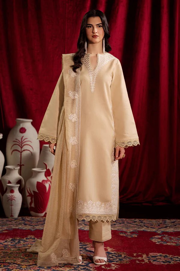 Model wearing Saffron Celestial Fall '24 FROSTED BEIGE, a graceful beige outfit with delicate embroidery, ideal for winter. Available as Pakistani designer clothes online in the UK.