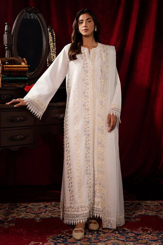 Model wearing a white Pearlescent dress from Saffron, adorned with intricate embroidery, ideal for winter, showcasing Pakistani designer clothes online in the UK.