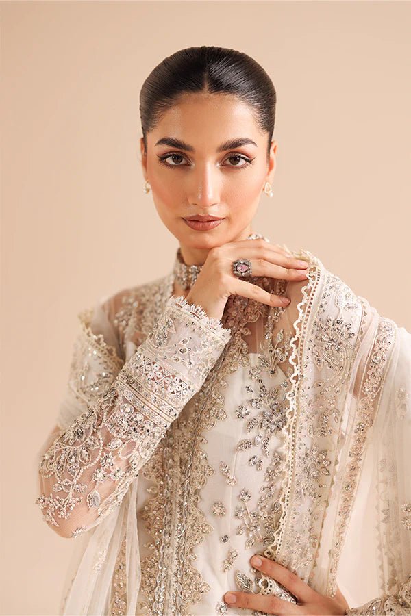 Model wearing 03 Glided Frost from Saffron's Edel Formals Collection in shimmering, icy tones. Pakistani clothes online in UK at Signature Labels