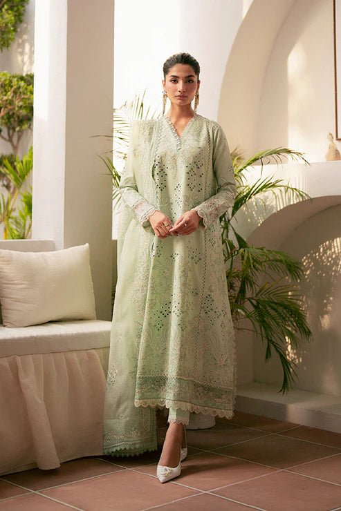 Model wearing mint green Alari dress from Saffron, highlighting Pakistani designer clothes in the UK. Perfect for festive lawn collections and readymade clothing.