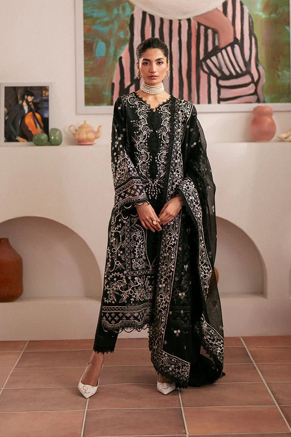 Model wearing black Ebony dress from Saffron, featuring intricate embroidery. Ideal for Pakistani designer clothes in the UK, readymade clothes, and festive lawn collections.