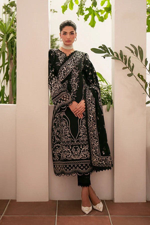 Model wearing black Ebony dress from Saffron, featuring intricate embroidery. Ideal for Pakistani designer clothes in the UK, readymade clothes, and festive lawn collections.