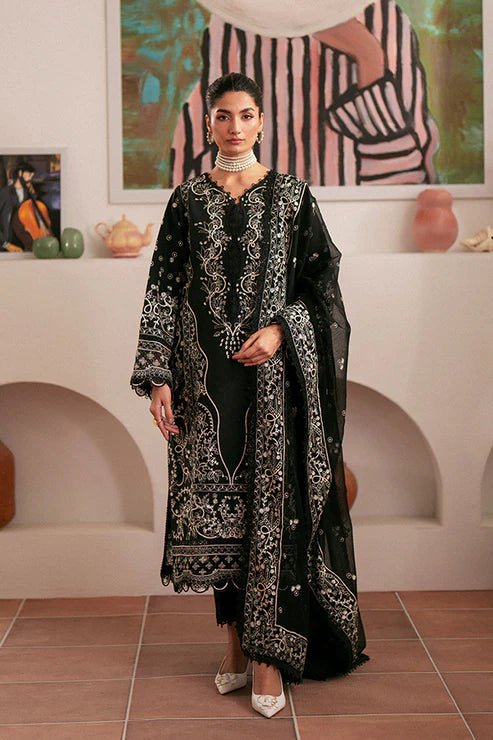 Model wearing black Ebony dress from Saffron, featuring intricate embroidery. Ideal for Pakistani designer clothes in the UK, readymade clothes, and festive lawn collections.