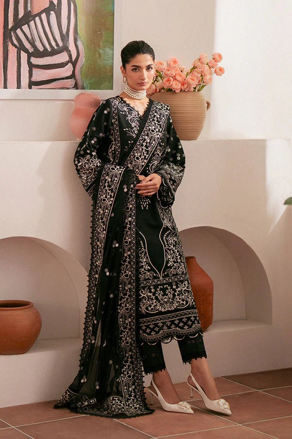 Model wearing black Ebony dress from Saffron, featuring intricate embroidery. Ideal for Pakistani designer clothes in the UK, readymade clothes, and festive lawn collections.