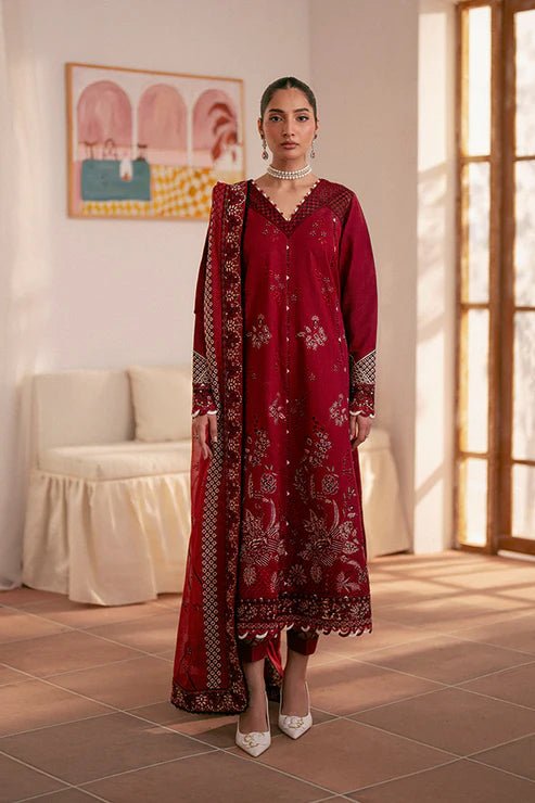 Model wearing deep red Selah dress from Saffron, showcasing Pakistani designer clothes in the UK. Ideal for festive lawn collections and readymade clothing.