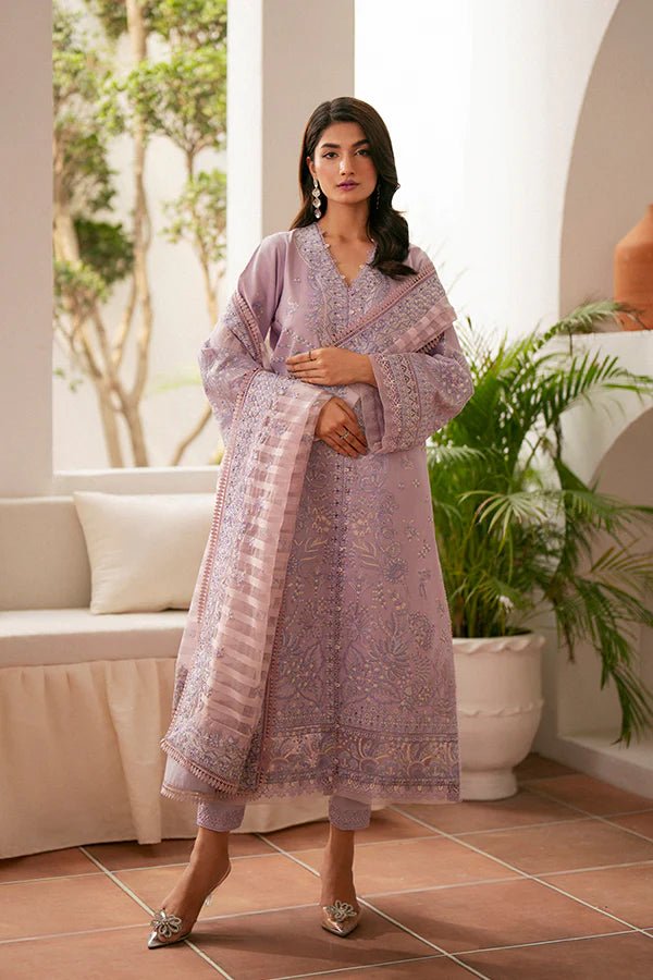 Model wearing lavender Zephyr dress from Saffron, featuring intricate embroidery. Ideal for Pakistani designer clothes in the UK, readymade clothes, and festive lawn collections.