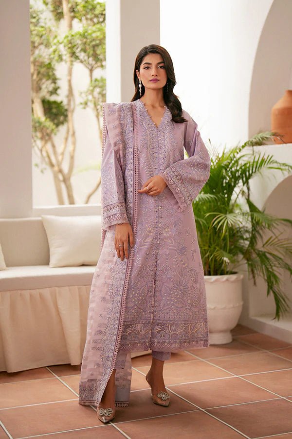 Model wearing lavender Zephyr dress from Saffron, featuring intricate embroidery. Ideal for Pakistani designer clothes in the UK, readymade clothes, and festive lawn collections.