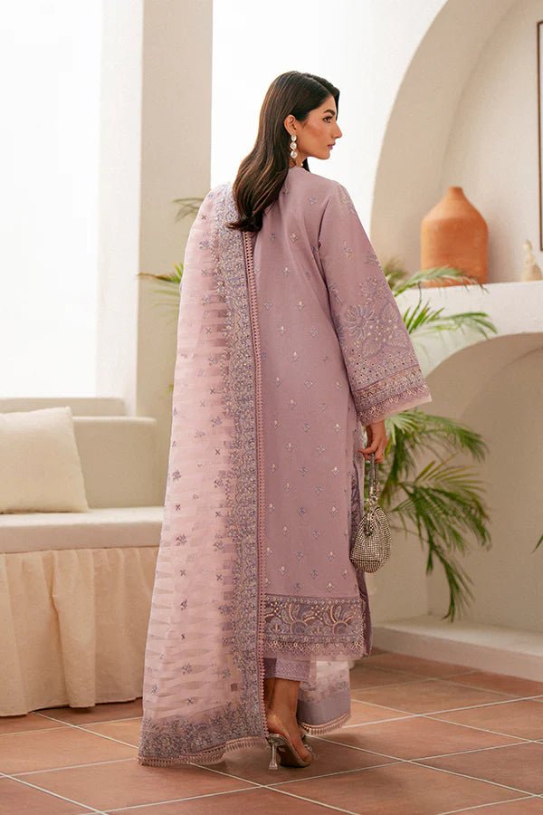 Model wearing lavender Zephyr dress from Saffron, featuring intricate embroidery. Ideal for Pakistani designer clothes in the UK, readymade clothes, and festive lawn collections.