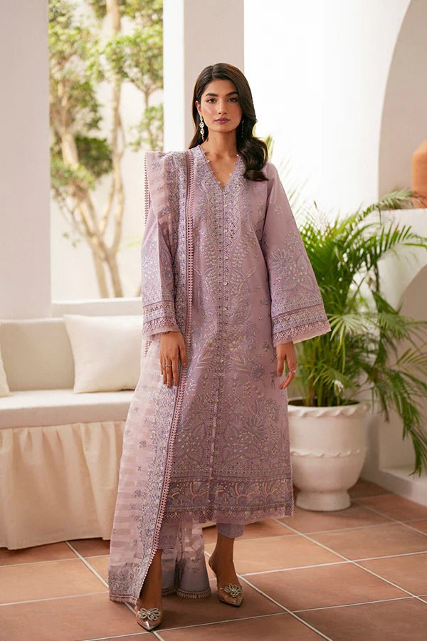 Model wearing lavender Zephyr dress from Saffron, featuring intricate embroidery. Ideal for Pakistani designer clothes in the UK, readymade clothes, and festive lawn collections.