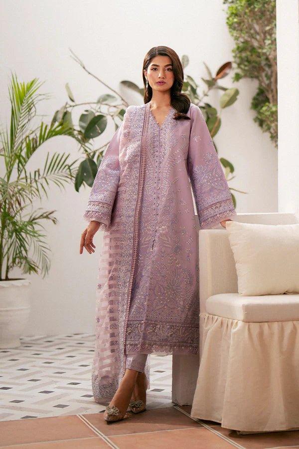 Model wearing lavender Zephyr dress from Saffron, featuring intricate embroidery. Ideal for Pakistani designer clothes in the UK, readymade clothes, and festive lawn collections.