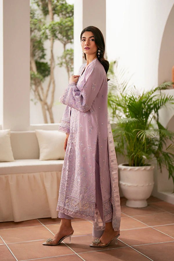 Model wearing lavender Zephyr dress from Saffron, featuring intricate embroidery. Ideal for Pakistani designer clothes in the UK, readymade clothes, and festive lawn collections.