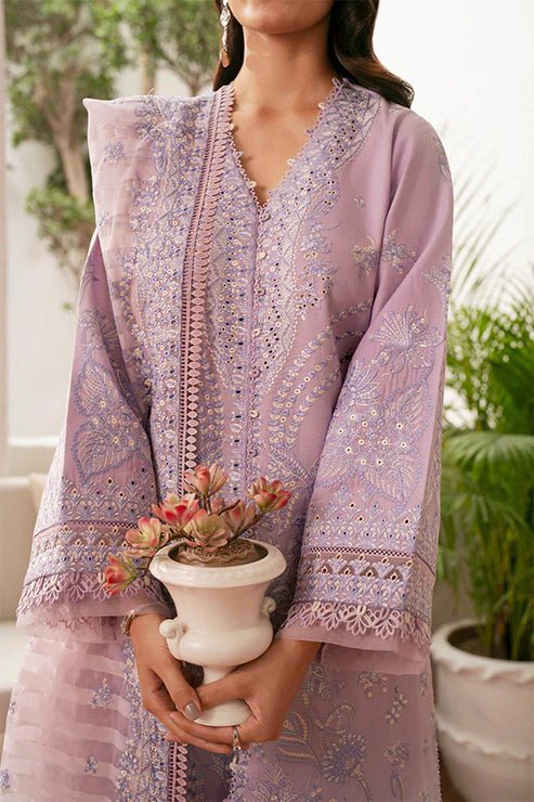 Model wearing lavender Zephyr dress from Saffron, featuring intricate embroidery. Ideal for Pakistani designer clothes in the UK, readymade clothes, and festive lawn collections.